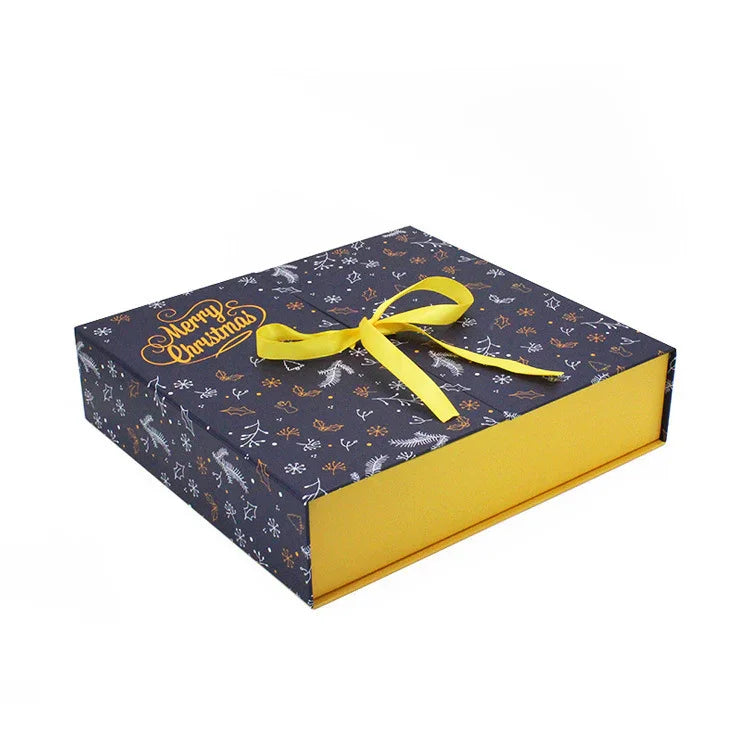 Decorative gift box with a yellow ribbon on a white background