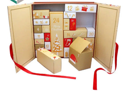 Open cardboard advent calendar with red ribbon on a white background